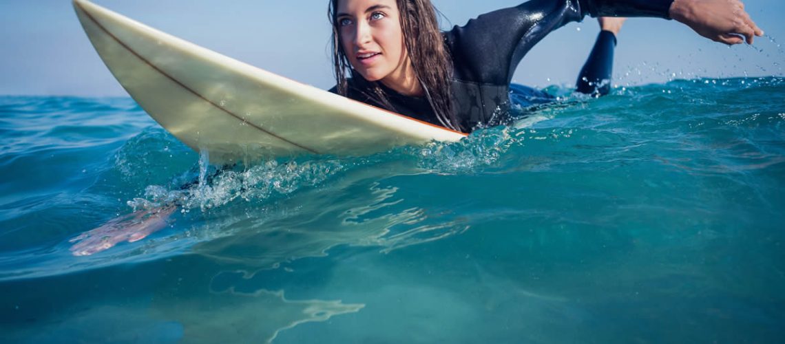 surfing girl water skincare